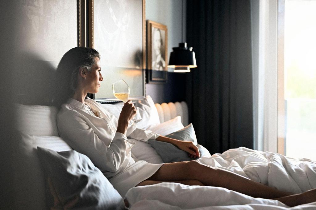 Postel nebo postele na pokoji v ubytování Wellnesshotel Wittelsbach