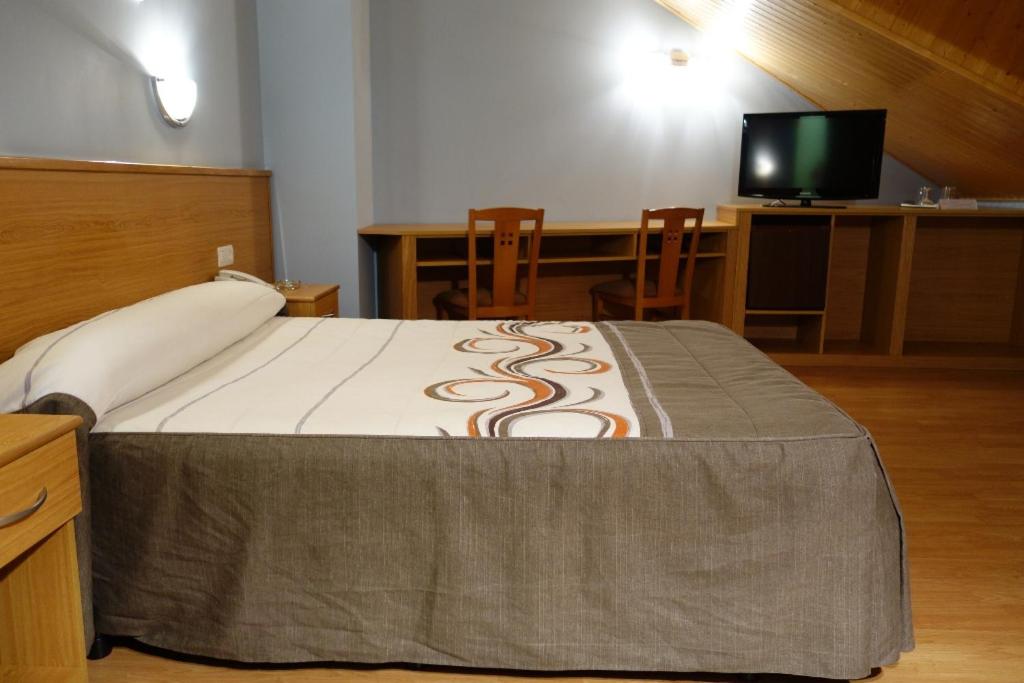 Postel nebo postele na pokoji v ubytování Hotel Reyes De León