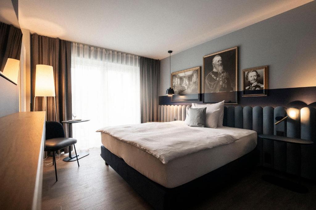Postel nebo postele na pokoji v ubytování Wellnesshotel Wittelsbach