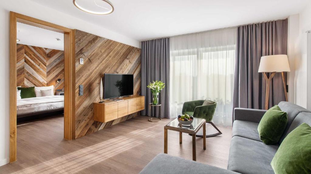 Postel nebo postele na pokoji v ubytování Wellnesshotel Wittelsbach