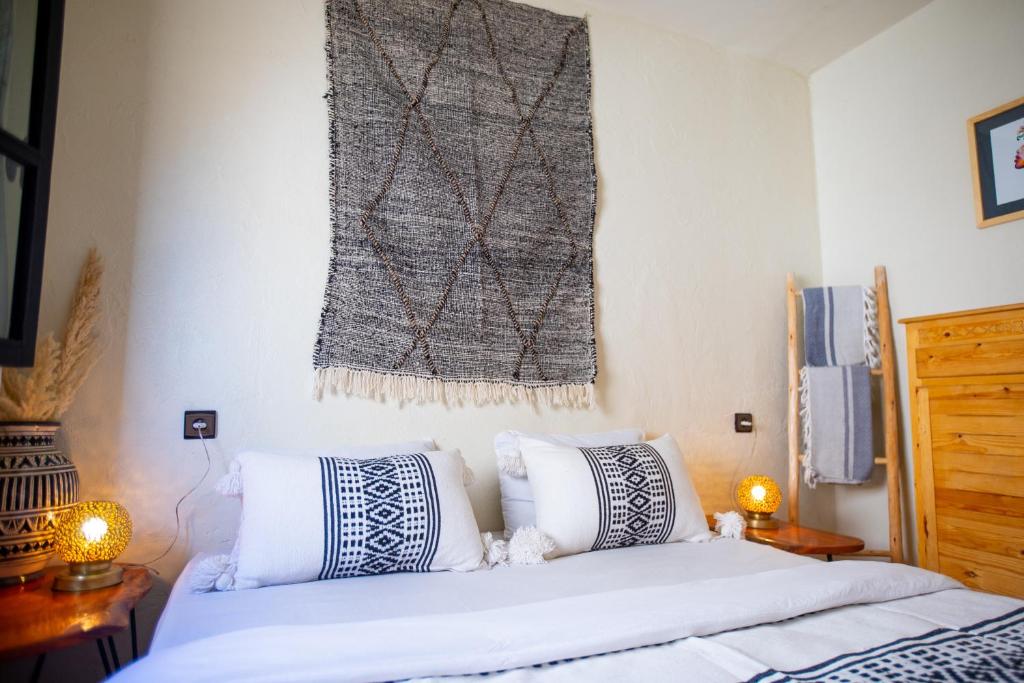 Postel nebo postele na pokoji v ubytování Anza surfhouse
