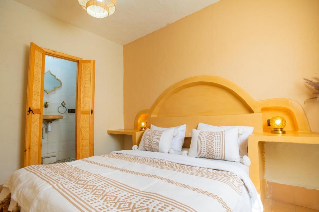 Postel nebo postele na pokoji v ubytování Anza surfhouse