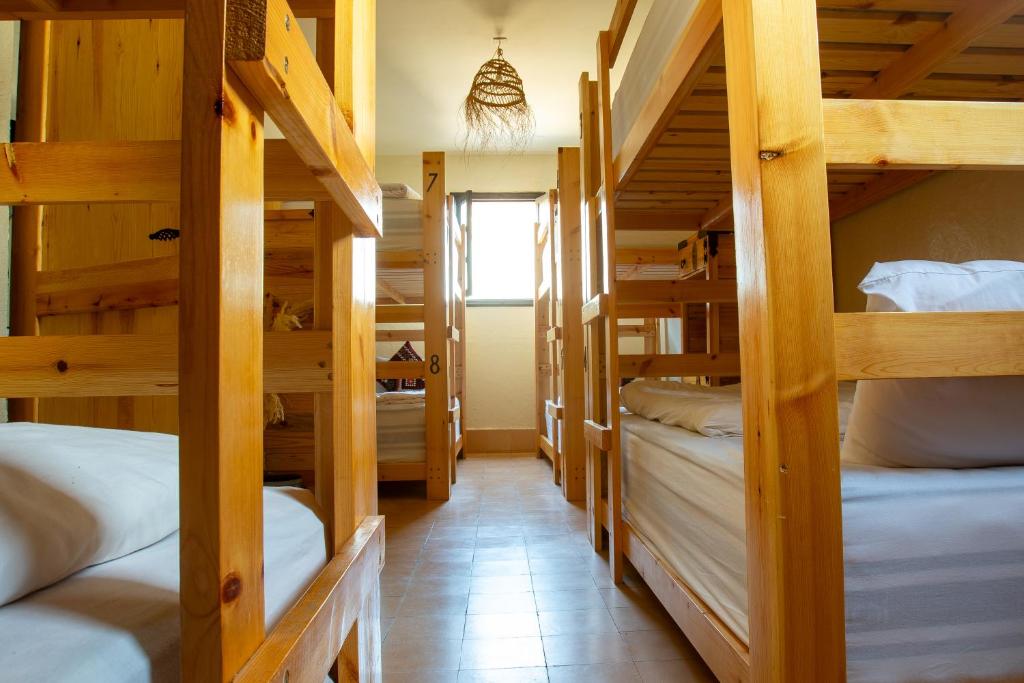 Postel nebo postele na pokoji v ubytování Anza surfhouse