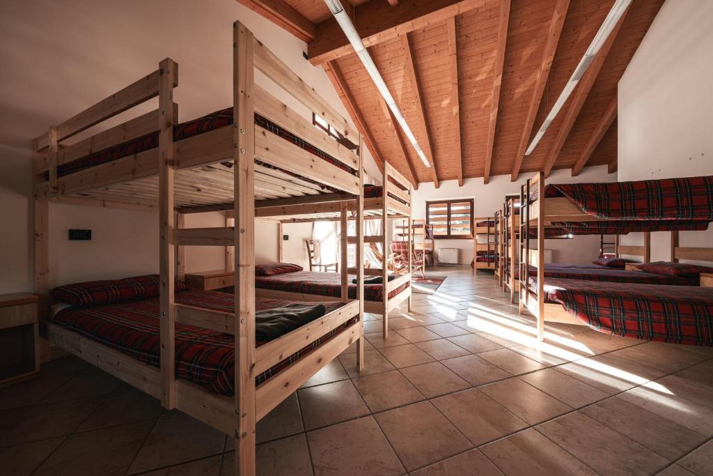 Postel nebo postele na pokoji v ubytování Forest Camp Val di Gresta