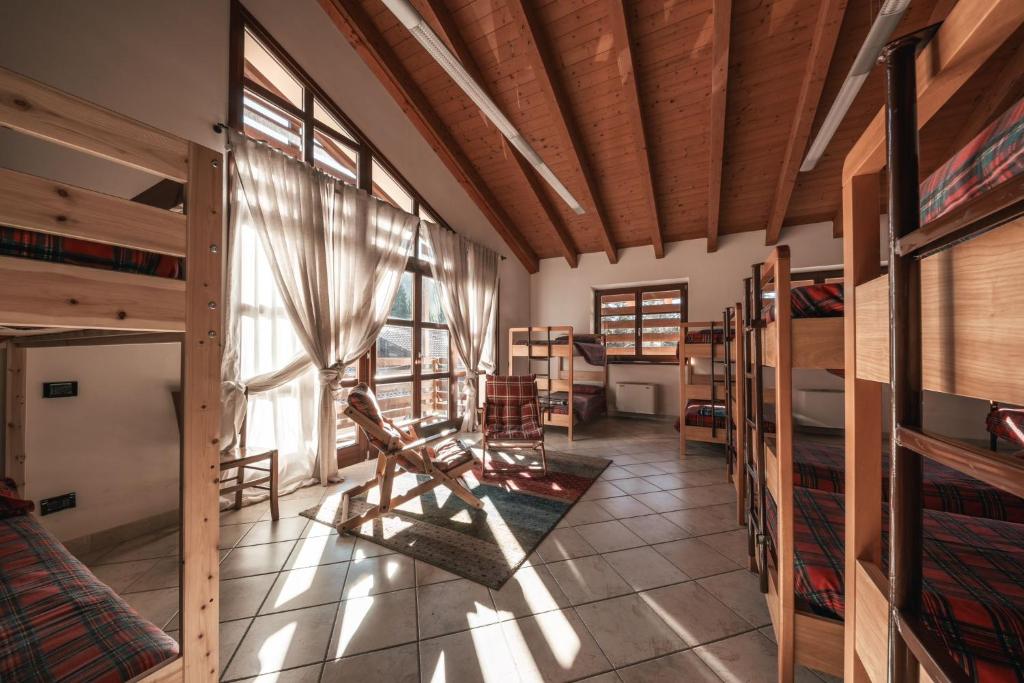 Postel nebo postele na pokoji v ubytování Forest Camp Val di Gresta