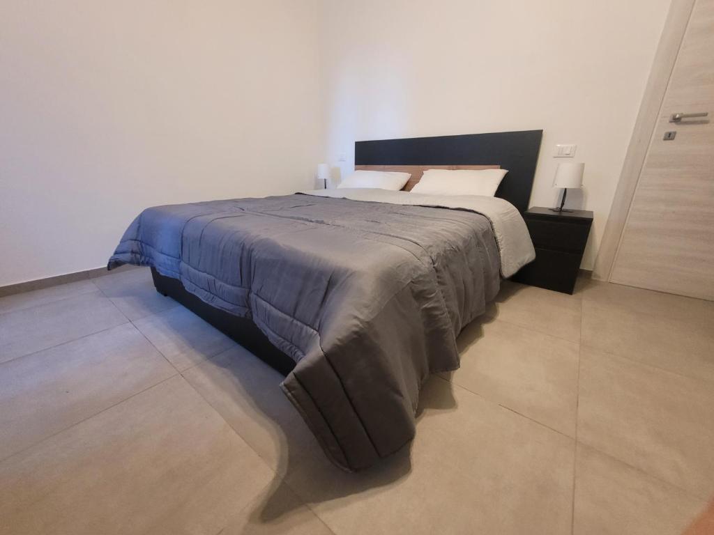 Postel nebo postele na pokoji v ubytování Appartamenti La Torre di Cascina