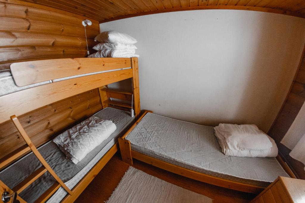Postel nebo postele na pokoji v ubytování Hotel Ylläsrinne
