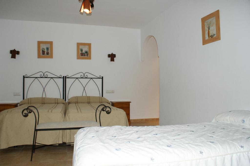 Postel nebo postele na pokoji v ubytování Hotel Juan Francisco