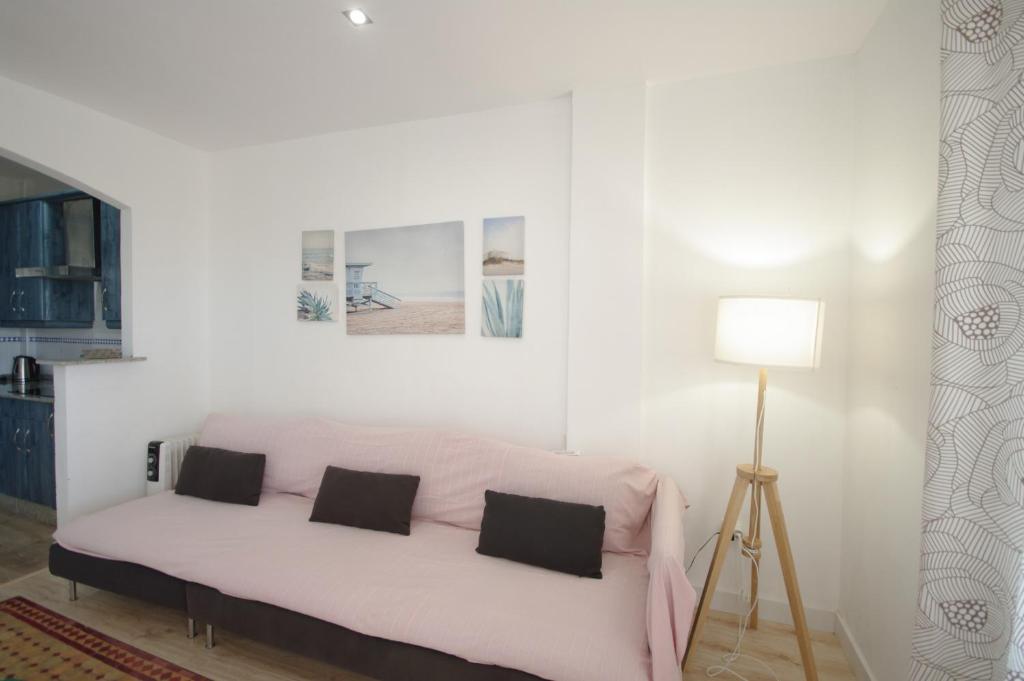 Postel nebo postele na pokoji v ubytování Livingtarifa Apartamento Guacamayo