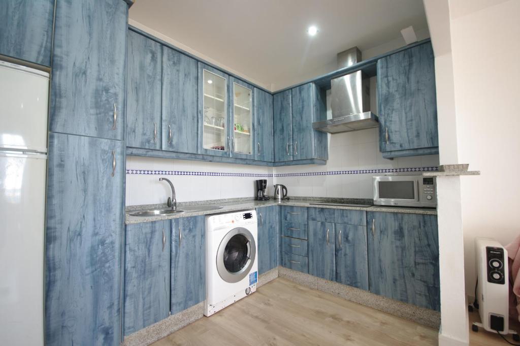 Kuchyň nebo kuchyňský kout v ubytování Livingtarifa Apartamento Guacamayo