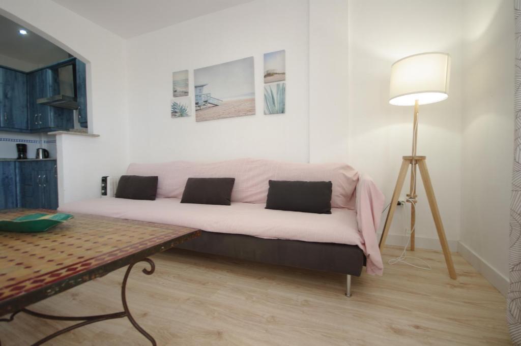 Postel nebo postele na pokoji v ubytování Livingtarifa Apartamento Guacamayo