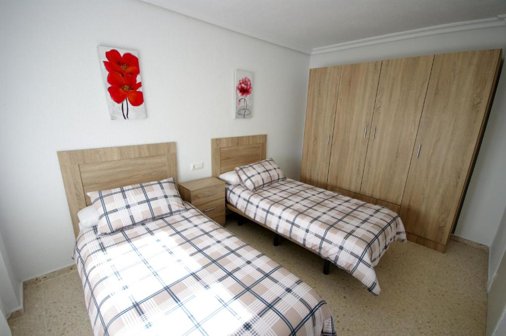 Postel nebo postele na pokoji v ubytování Livingtarifa Casa Del Mar
