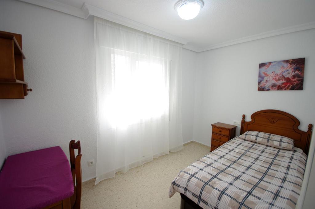Postel nebo postele na pokoji v ubytování Livingtarifa Casa Del Mar