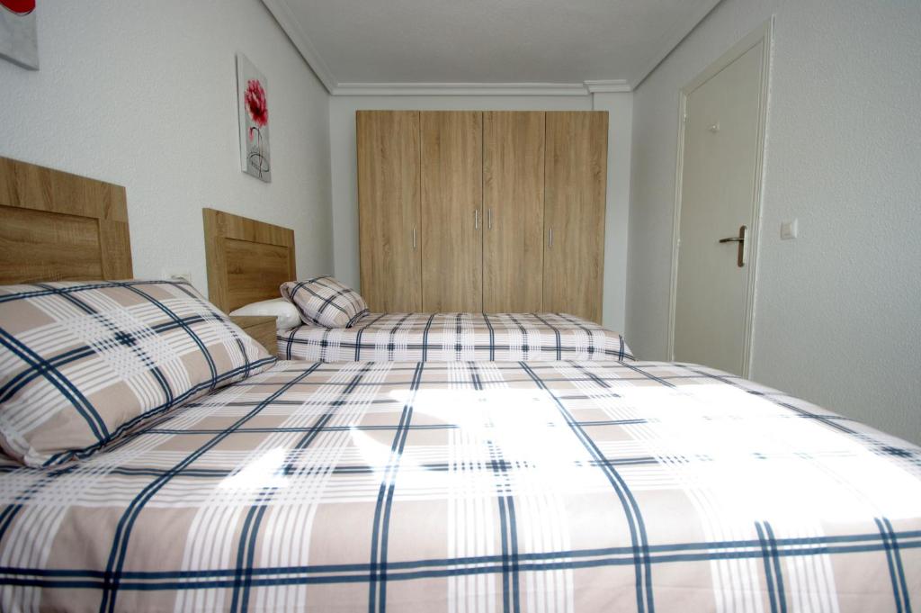 Postel nebo postele na pokoji v ubytování Livingtarifa Casa Del Mar