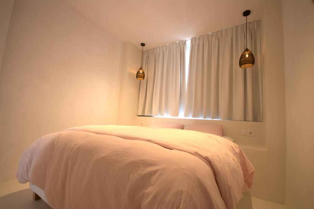 Postel nebo postele na pokoji v ubytování Livingtarifa Apartamento Valhalla