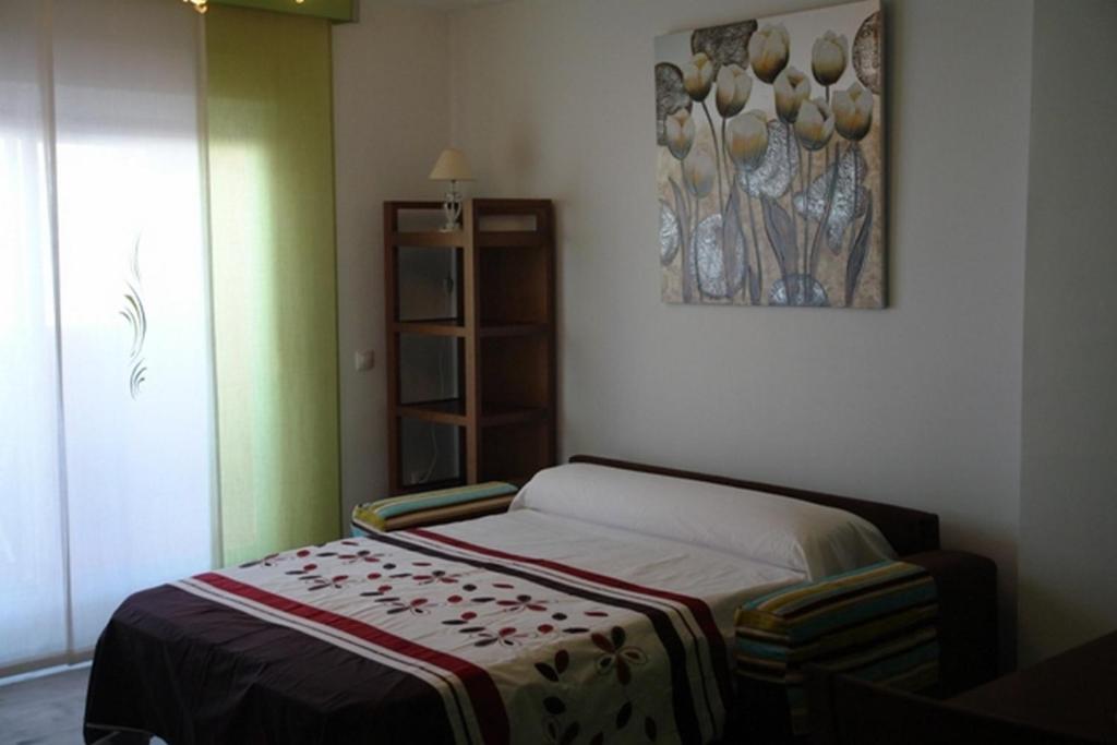 Posteľ alebo postele v izbe v ubytovaní Livingtarifa Apartamento Simba