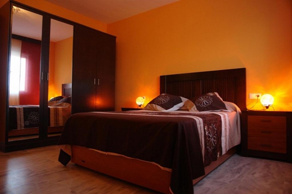 Posteľ alebo postele v izbe v ubytovaní Livingtarifa Apartamento Simba