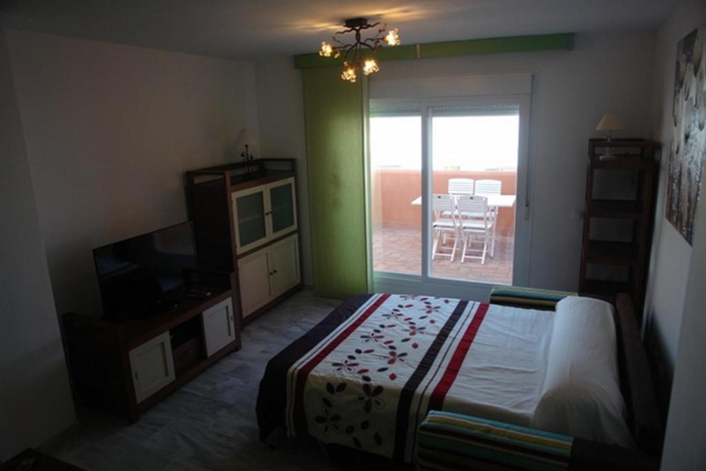 Posteľ alebo postele v izbe v ubytovaní Livingtarifa Apartamento Simba