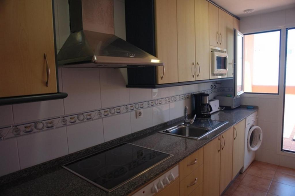 Kuchyňa alebo kuchynka v ubytovaní Livingtarifa Apartamento Simba
