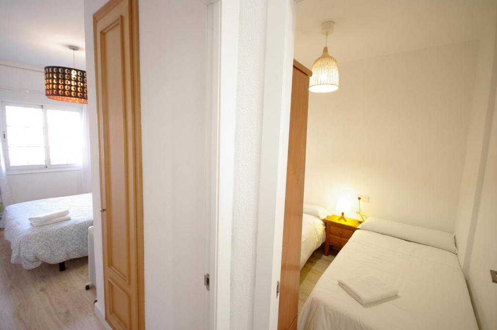 Postel nebo postele na pokoji v ubytování Livingtarifa Apartamento Agaporni