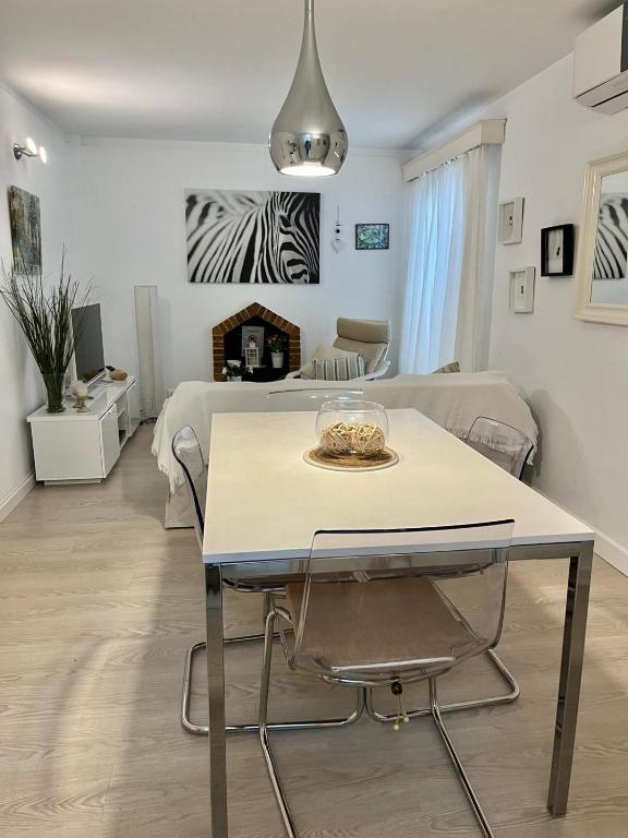 a room with a table and a bed at Marian Gola in Port de Pollensa