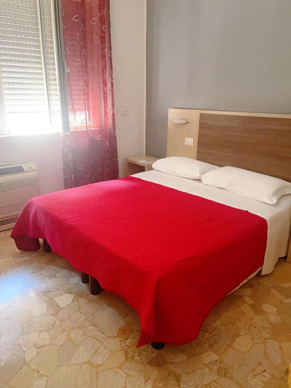 Postel nebo postele na pokoji v ubytování HOTEL BISSI