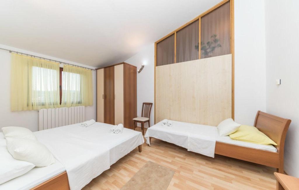 Posteľ alebo postele v izbe v ubytovaní House Rafaeli