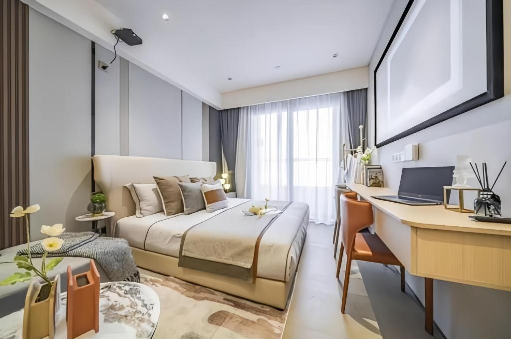 Postel nebo postele na pokoji v ubytování Raffles Executive Apartment - Guangzhou Huijin International Finance Center, Keyun Road Metro Station Branch-Canton Fair Free Shuttle