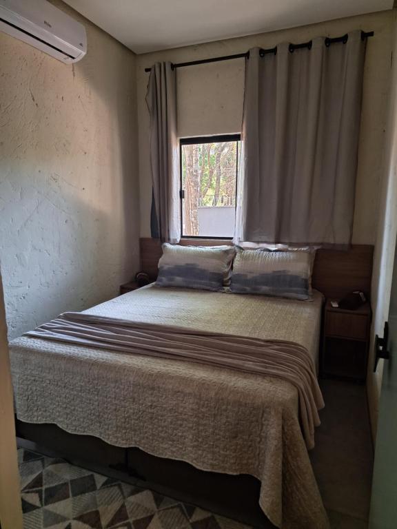 Postel nebo postele na pokoji v ubytování Casa bosque do Garapiá- Taquaruçu