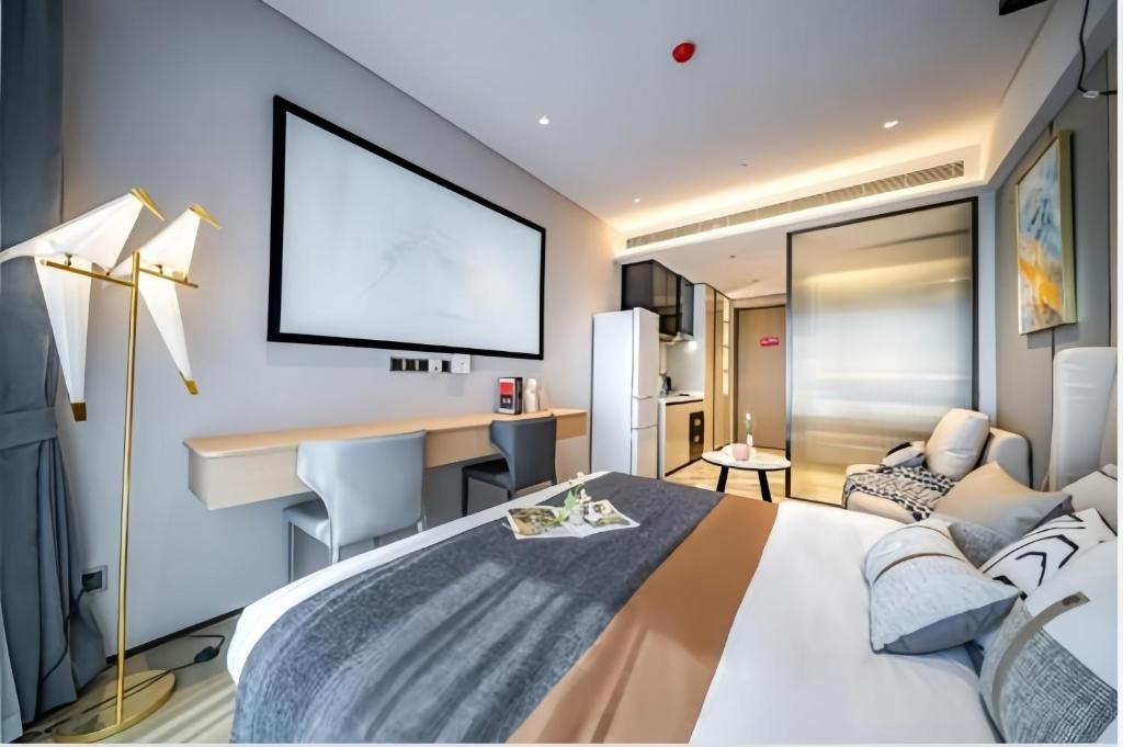 Postel nebo postele na pokoji v ubytování Raffles Executive Apartment - Guangzhou Huijin International Finance Center, Keyun Road Metro Station Branch-Canton Fair Free Shuttle