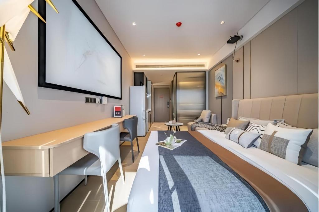 Postel nebo postele na pokoji v ubytování Raffles Executive Apartment - Guangzhou Huijin International Finance Center, Keyun Road Metro Station Branch-Canton Fair Free Shuttle