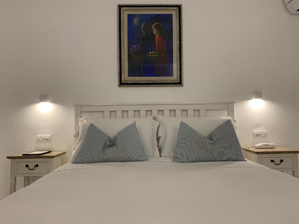 Postel nebo postele na pokoji v ubytování Bettola del Re home boutique b&b