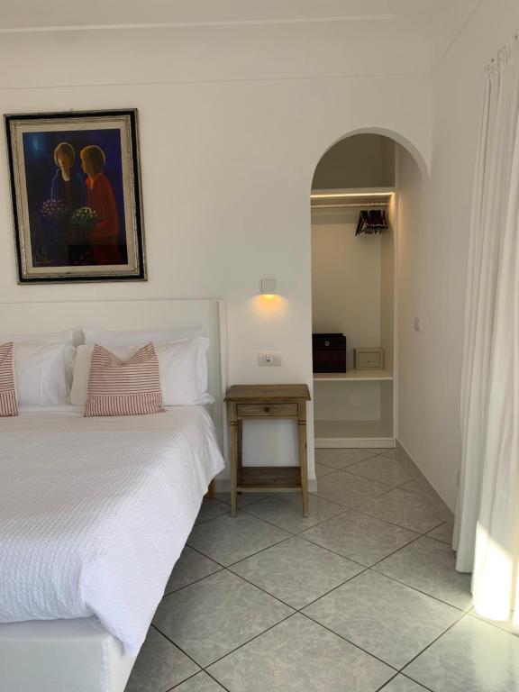 Postel nebo postele na pokoji v ubytování Bettola del Re home boutique b&b