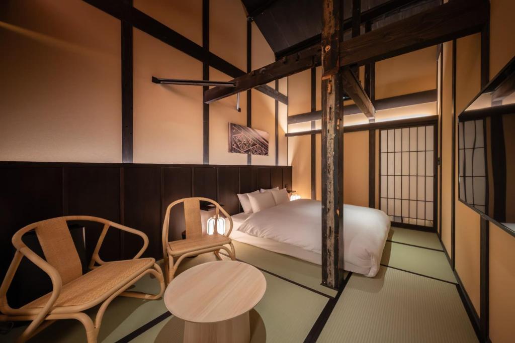 Postel nebo postele na pokoji v ubytování Nazuna Kyoto Higashi Honganji