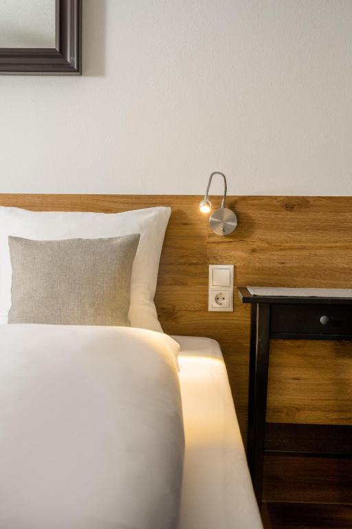 Posteľ alebo postele v izbe v ubytovaní Hotel Standlhof Zillertal