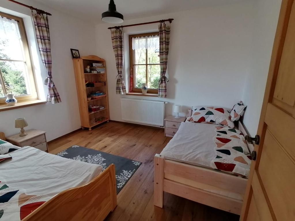 Postel nebo postele na pokoji v ubytování Chalupa U Maňouse