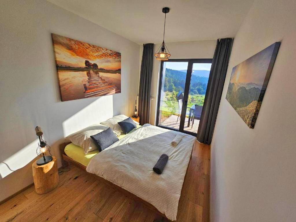 Ένα ή περισσότερα κρεβάτια σε δωμάτιο στο Superior apartment s terasou 2 - Ski&Bike, Janské Lázně