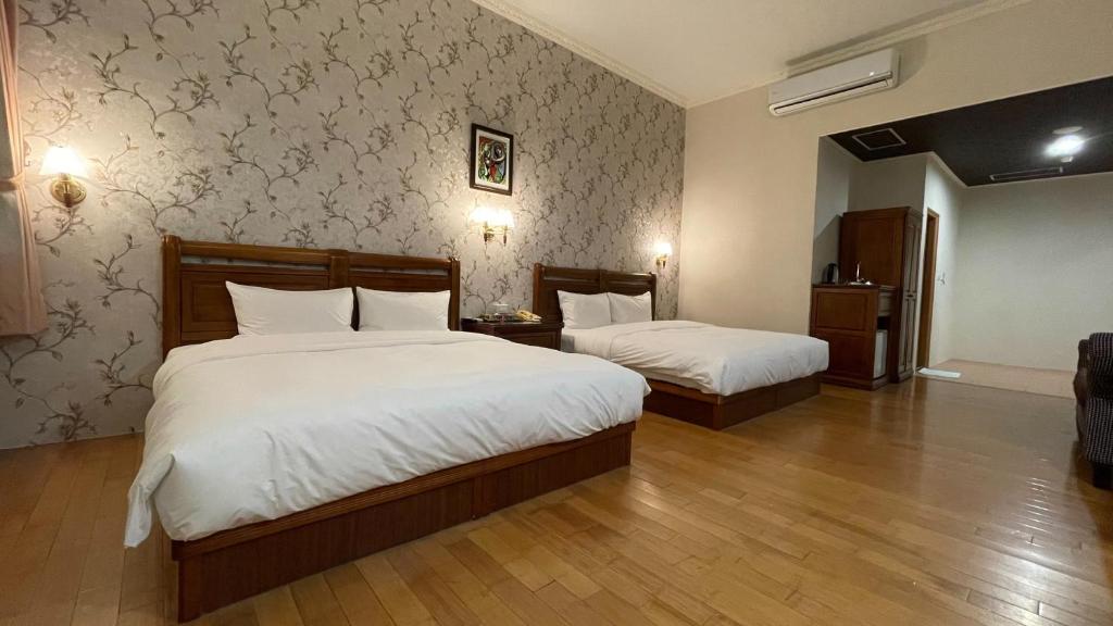 Postel nebo postele na pokoji v ubytování Di Bao Motel