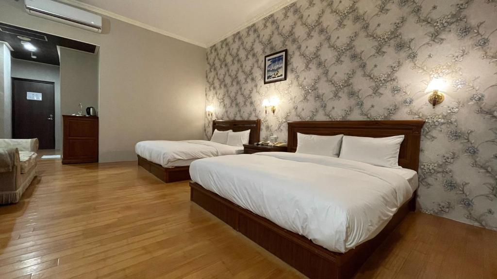 Postel nebo postele na pokoji v ubytování Di Bao Motel