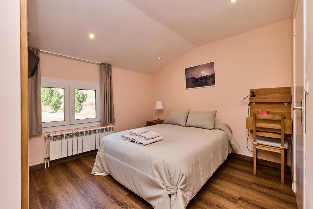 Postel nebo postele na pokoji v ubytování Hotel Peretol