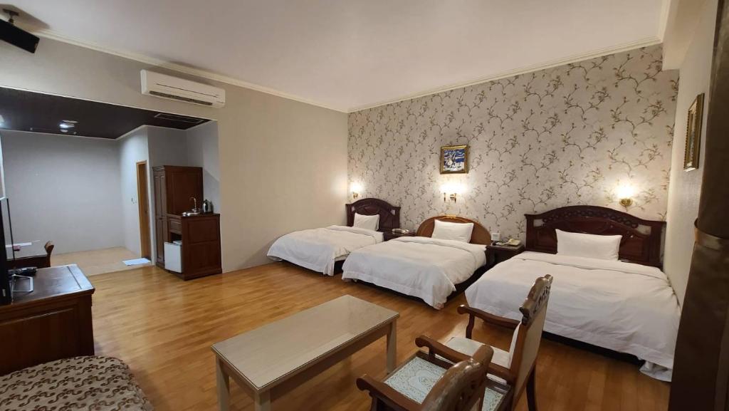 Postel nebo postele na pokoji v ubytování Di Bao Motel