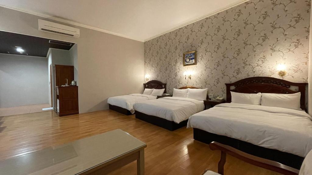 Postel nebo postele na pokoji v ubytování Di Bao Motel
