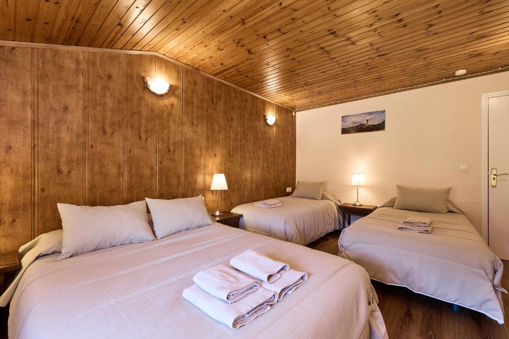 Postel nebo postele na pokoji v ubytování Hotel Peretol