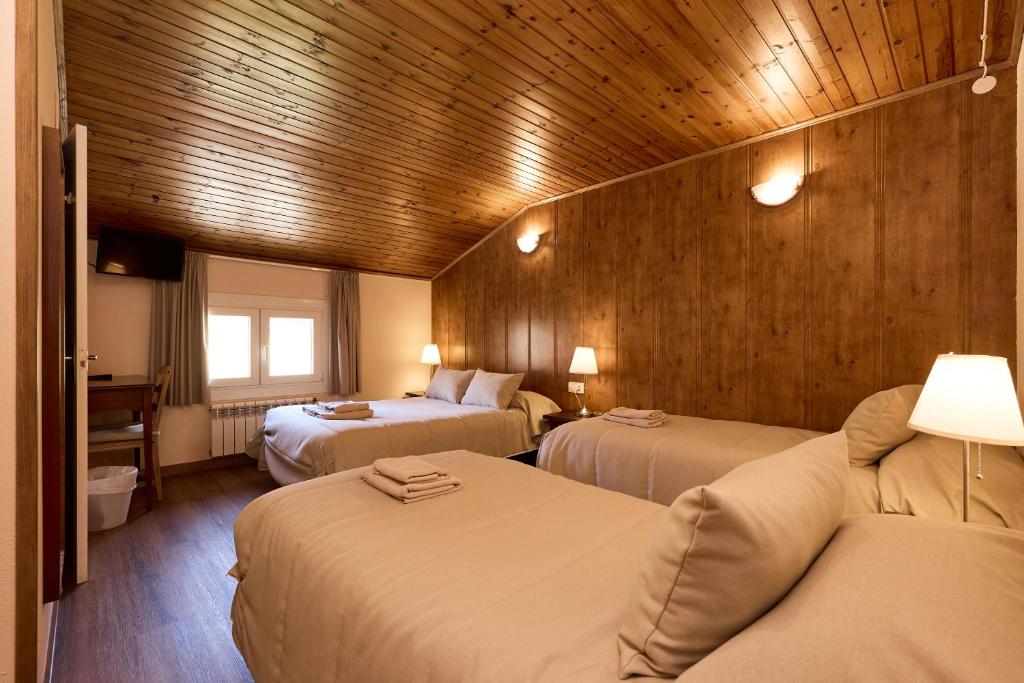 Postel nebo postele na pokoji v ubytování Hotel Peretol