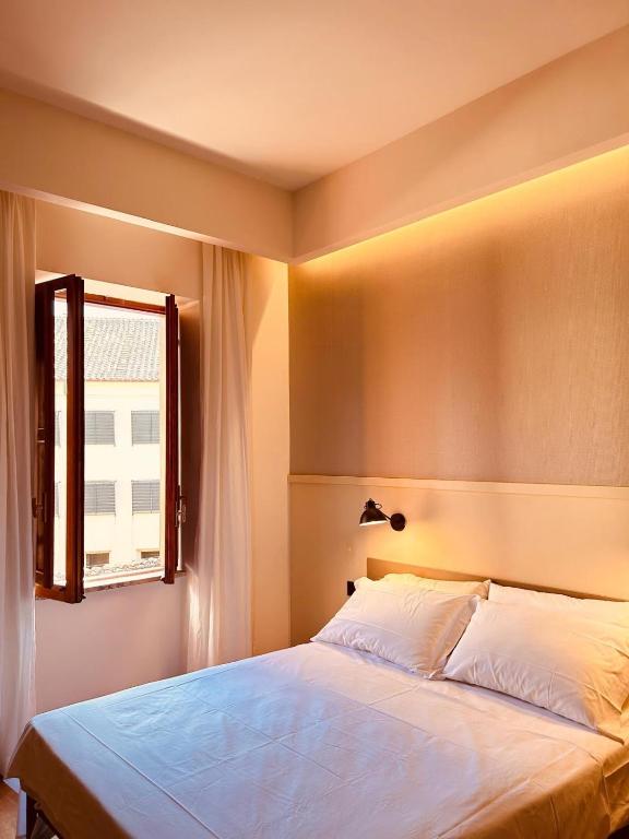 Postel nebo postele na pokoji v ubytování Residenza Leone XIII