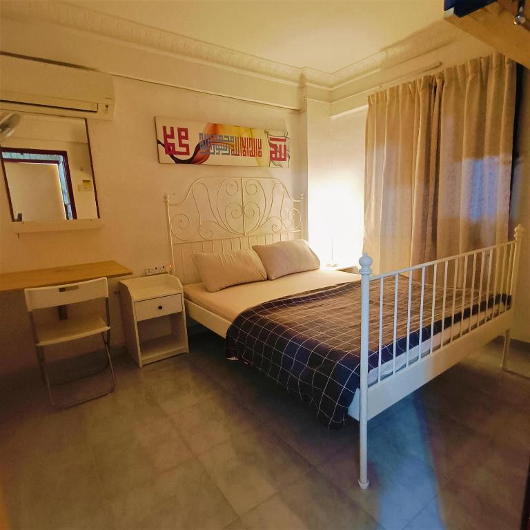 Postel nebo postele na pokoji v ubytování Awedee Homestay Putrajaya