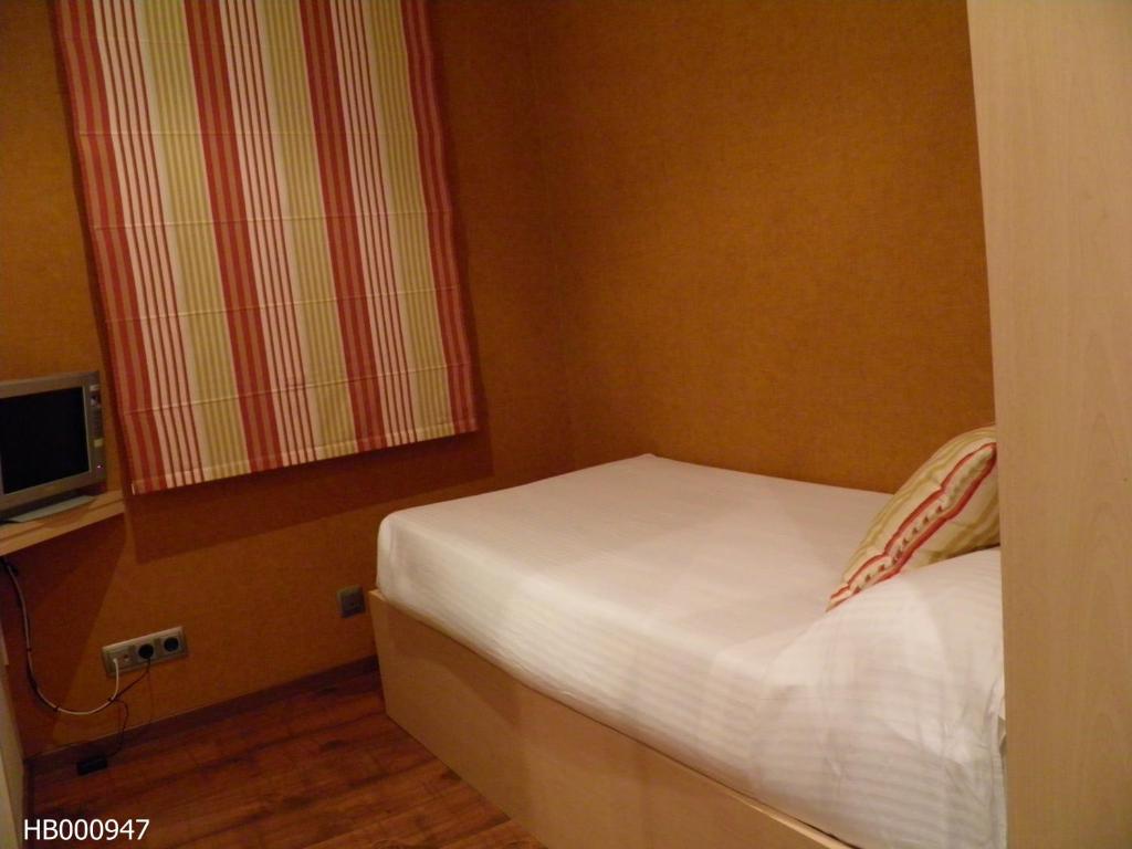 Postel nebo postele na pokoji v ubytování Hotel Annex - Rey Don Jaime I