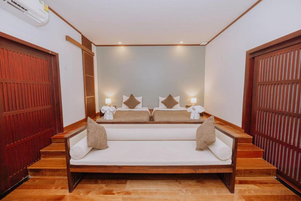 Postel nebo postele na pokoji v ubytování begonia N7 villa resort海棠7号别墅酒店