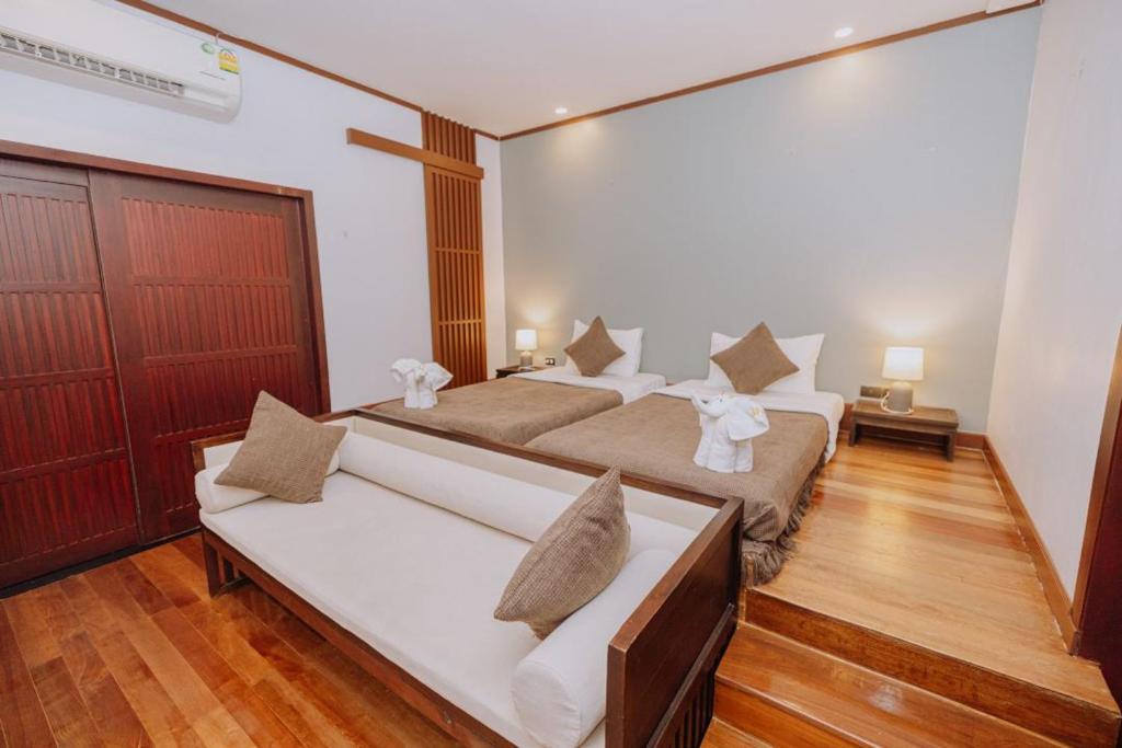 Postel nebo postele na pokoji v ubytování begonia N7 villa resort海棠7号别墅酒店