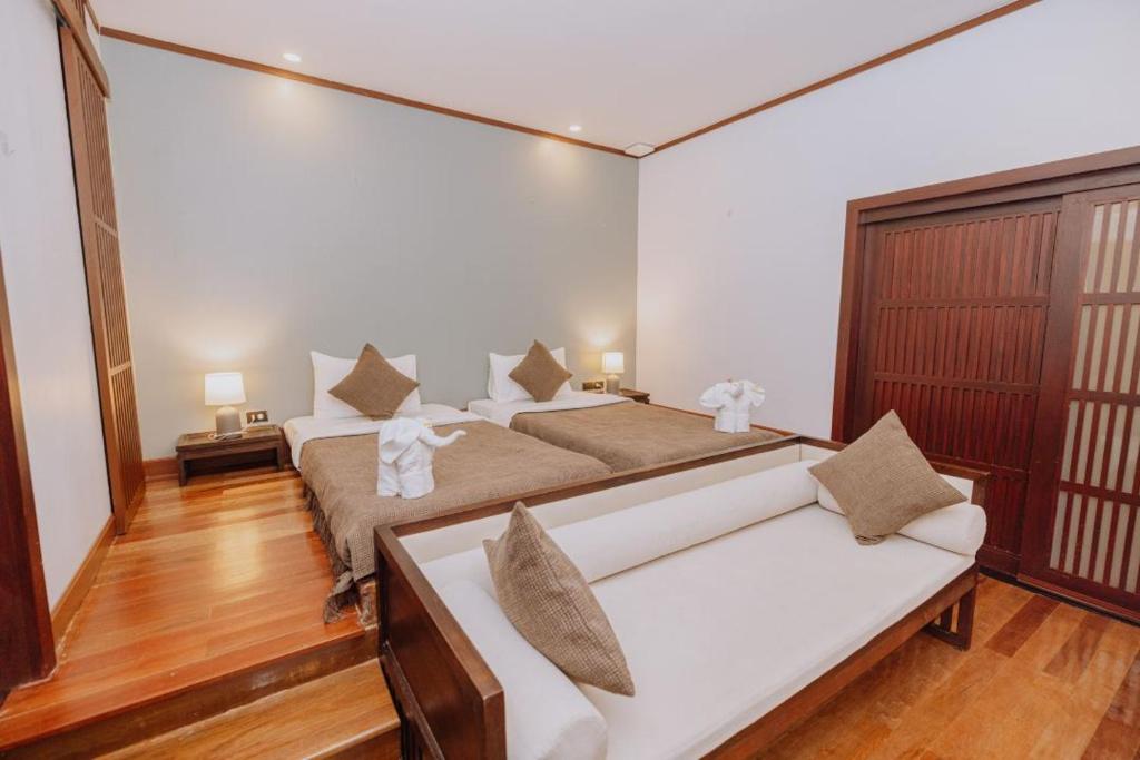 Postel nebo postele na pokoji v ubytování begonia N7 villa resort海棠7号别墅酒店